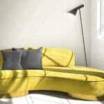 Cozy yellow sofa in living room in sunlight shadow pattern