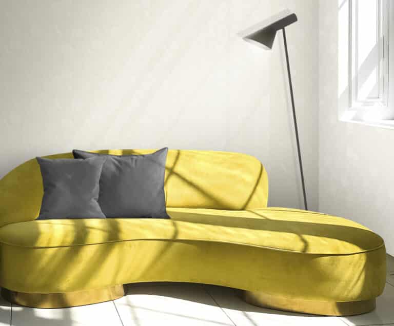 Cozy yellow sofa in living room in sunlight shadow pattern