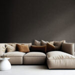 light brown sofa with beige carpet in apartment on grey wall background
